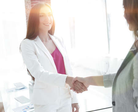 welcome handshake women business partnersの写真素材