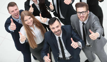 successful business team holding up a thumbs up