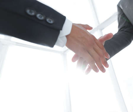 Two  business men going to make handshakeの写真素材