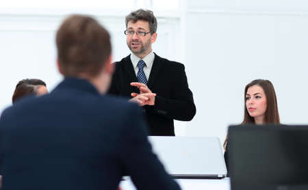 senior Manager makes a report at the briefing.