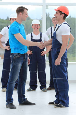 handshake of the architect and the superintendent