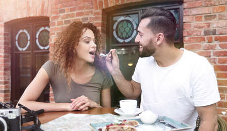 Couple on european vacation sitting in outdoors cafeの写真素材