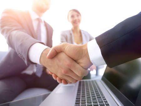 closeup. confident handshake colleagues