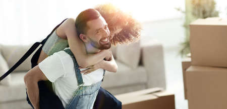 Wife and husband are happy to move to a new home.