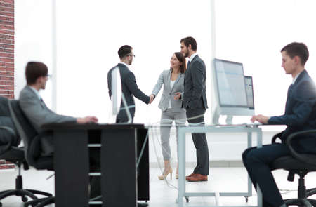 Salesmen and buyer discuss the contract