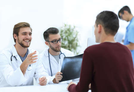doctors discuss with the patient the x-rayの写真素材
