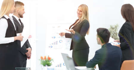 business woman doing a presentation to his business team.