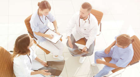 medical staff ,discussing the work plan with the patientsの写真素材