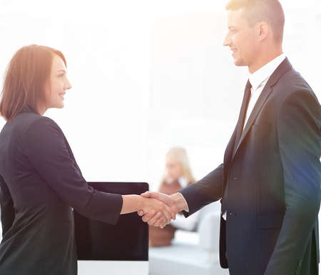 handshake business partners at the negotiating table.の写真素材