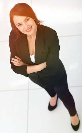 photo in full growth, successful business woman looking at camerの写真素材