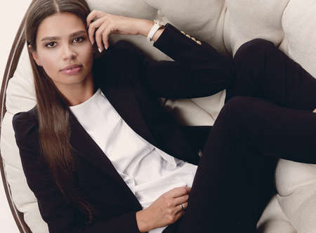 business woman thinking,sitting in a round chair