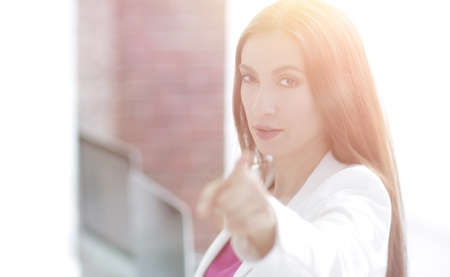 confident business woman pointing finger forwardの写真素材