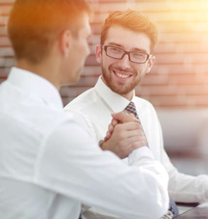 handshake Manager and customer in a modern officeの写真素材