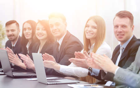 business team applauding the speaker at the workshop