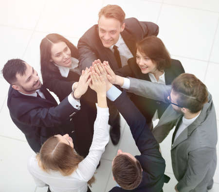 closeup. joyful business team with folded hands togetherの写真素材