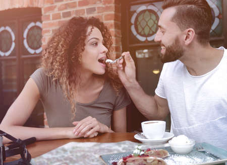 Couple on european vacation sitting in outdoors cafeの写真素材