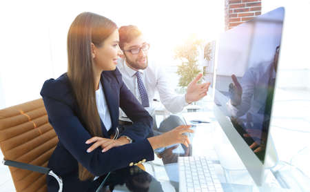 business woman with a colleague sitting at a Deskの写真素材