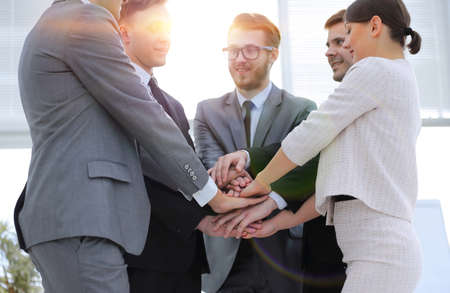 closeup. business team with hands clasped togetherの写真素材