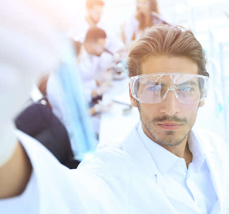 tube with reagents on blurred background laboratory.の写真素材