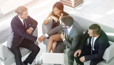 handshake Manager and the client sitting in the office lobby.の写真素材