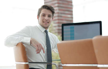 employee sitting in front of a computer screen