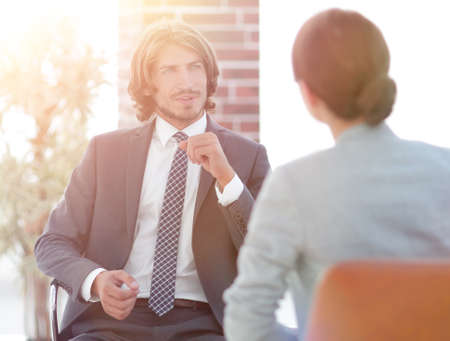 A relaxed conversation of a man and a woman in the officeの写真素材