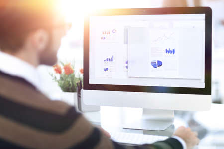 closeup.a businessman looks at the marketing scheme