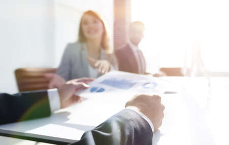 image is blurred. business team in the workplace