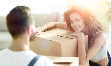 Portrait of a young wife when moving to a new house