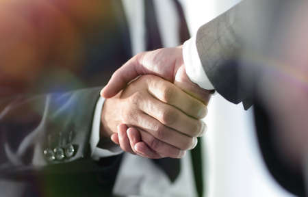 Business men giving a handshake. Business conceptの写真素材