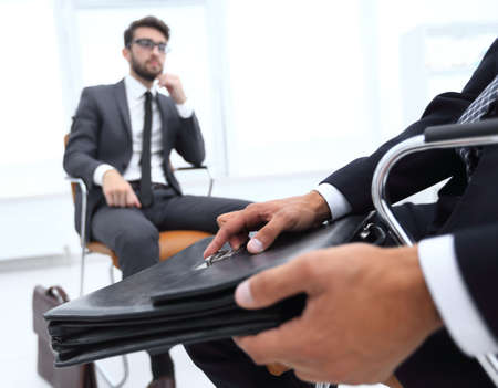 Elegant man in suit with briefcaseの写真素材