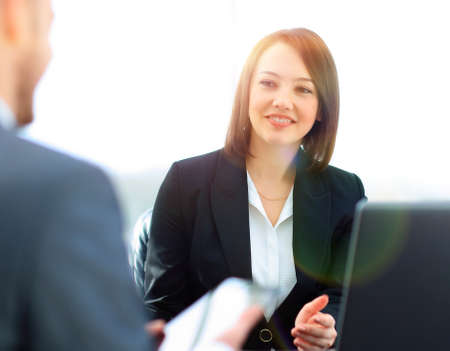 Business people working together at the desk in the officeの写真素材