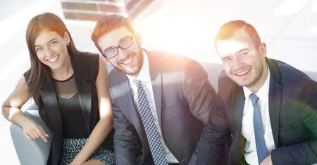portrait of successful business team sitting in office lobby