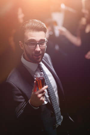 Elegant man with a champagne glassの写真素材