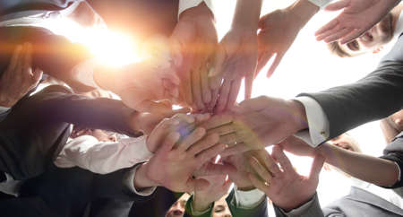 large business team is forming a circle and his hands clasped toの写真素材