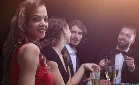 adult group celebrating friend winning blackjack