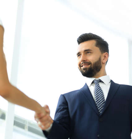 Image of business partners handshaking in officeの写真素材
