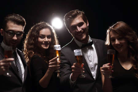 portrait of a group of friends celebrating their successの写真素材