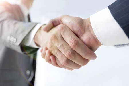 Diverse business male shaking hands.の写真素材