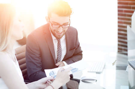 Senior manager and employee discussing financial documentsの写真素材