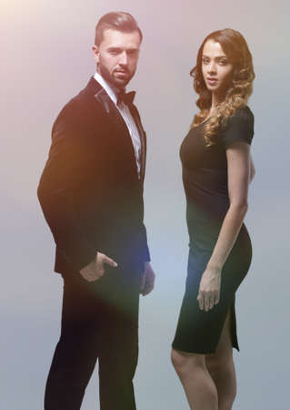 Business partners standing on a gray backgroundの写真素材