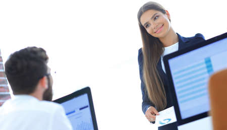 business colleagues discussing work issues at the officeの写真素材