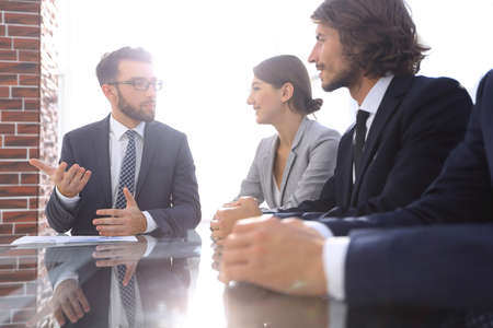 Manager holds a meeting with the business team