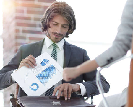 A relaxed conversation of a man and a woman in the officeの写真素材