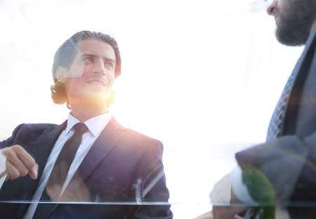 business partners sitting at a Deskの写真素材