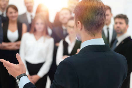 businessman makes a speech to his team.の写真素材