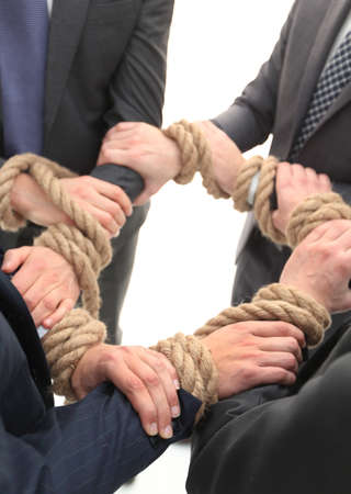 closeup.group of business people holding hands