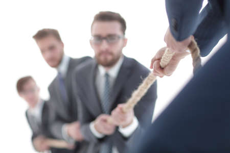image is blurred.the tug of war between business people.の写真素材
