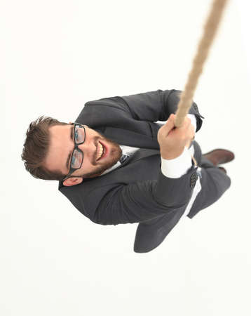 successful businessman climbing the ropeの写真素材