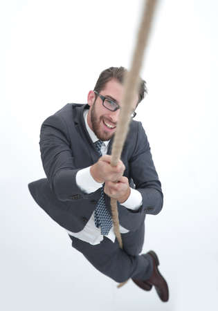 successful businessman climbing the ropeの写真素材